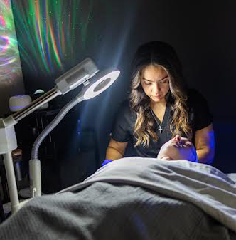 a woman getting a hyrdrafacial treatment